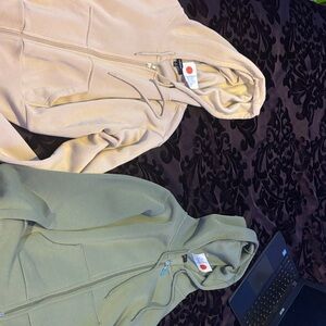 Beige and Green Zip-Up Hoodies
